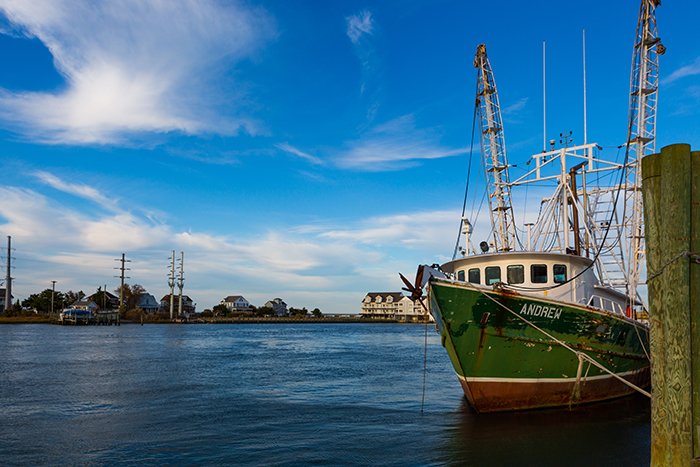 A commercial fishing boat docked in a harbor